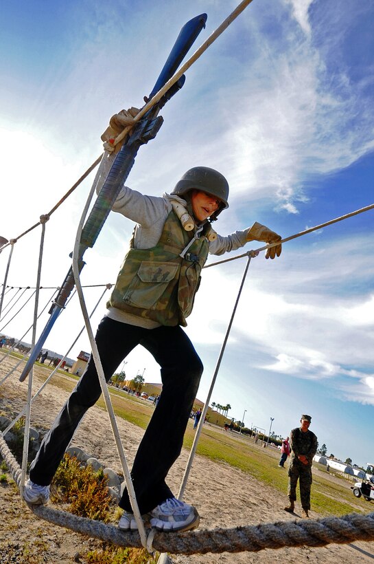 Mary Gamboa, of Paradise Valley High School, Phoenix  Ariz., participates in the Bayonet Assault Course aboard Marine Corps Recruit Depot San Diego, Calif. Each year educators throughout the 10 states, which make up the 8th Marine Corps District, participate in the Educators Workshop, a five day event in Southern Calif. which allows high school teachers to experience Marine Corps recruit training.